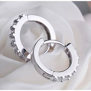 The Mini Hoop huggie dainty earrings in 925 and cubic zirconia